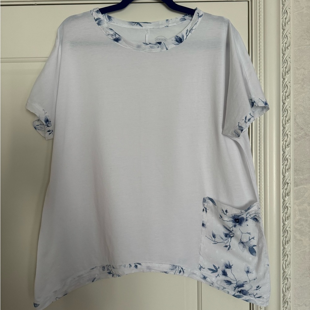 White top with pocket on the side.